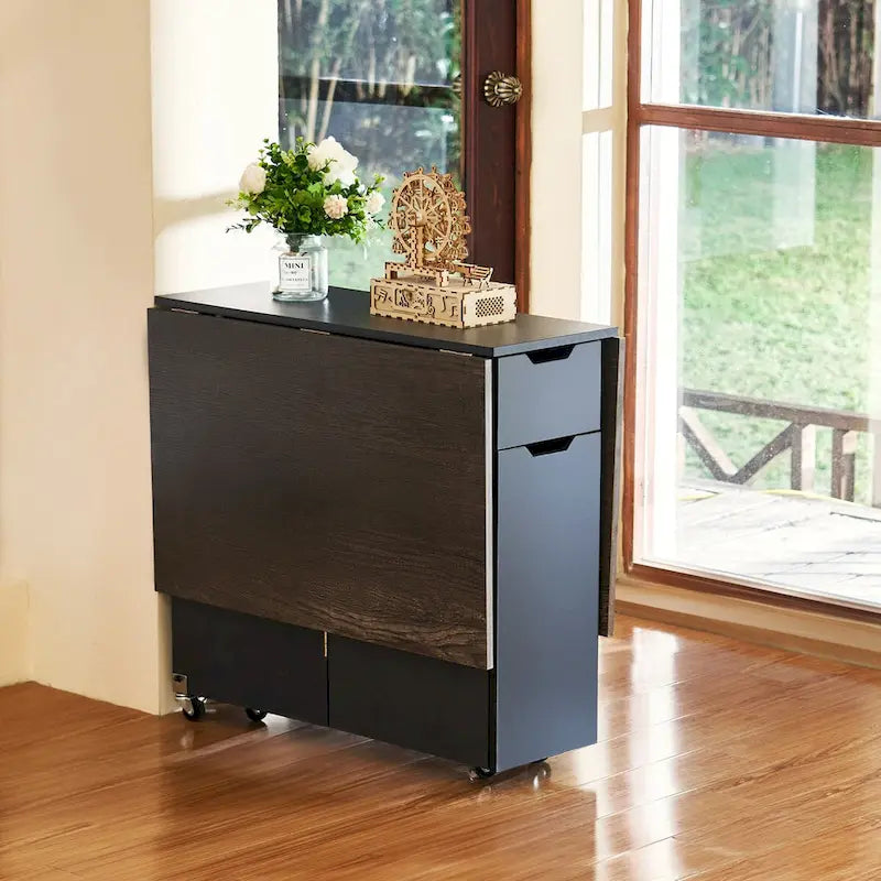 Table à manger marron extensible à abattants avec tiroir de rangement, placard et roulettes – Pour 2 à 4 personnes